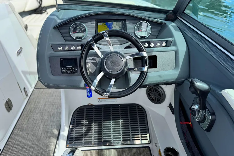 Slide: The Image of Steering console of a 2016 Cobalt R5 boat with modern controls and dashboard. - 21