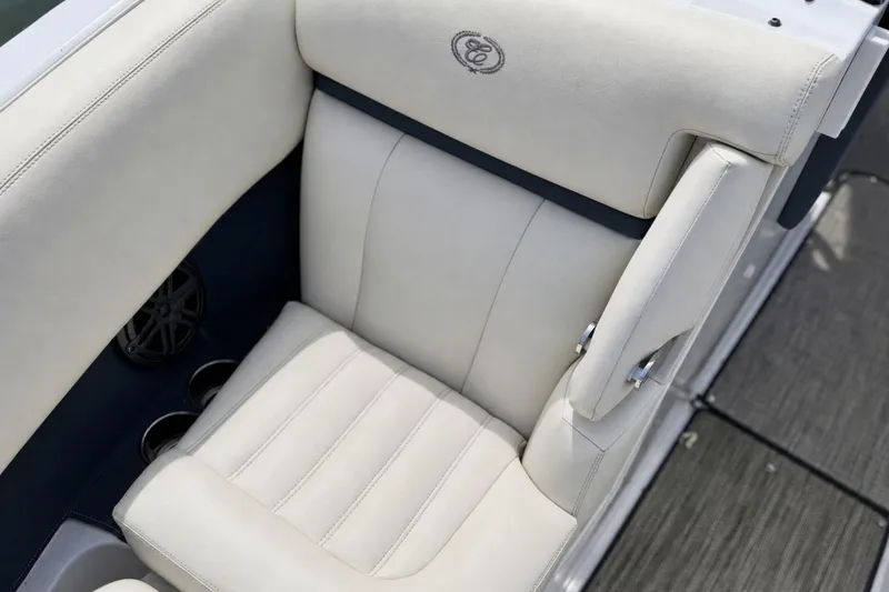 Slide: The Image of Luxurious white leather seat on 2016 Cobalt R5 boat, featuring elegant stitching and armrest. - 23