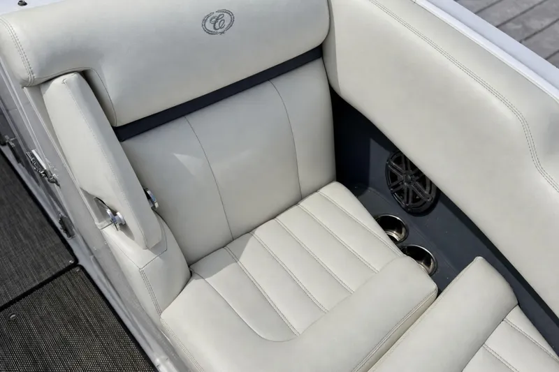 Slide: The Image of Luxurious seating in a 2016 Cobalt R5 boat, featuring premium upholstery and integrated cup holders. - 24