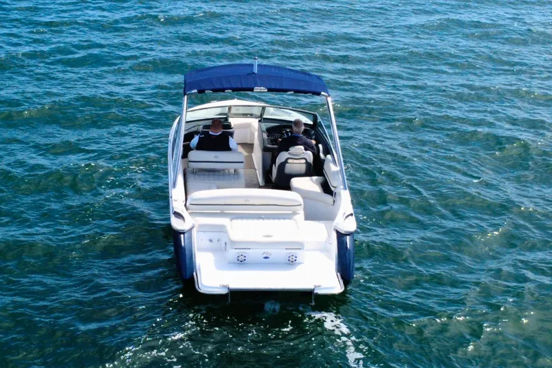 Slide: The Image of 2016 Cobalt R5 boat cruising on open water, featuring a sleek design and spacious seating. - 8