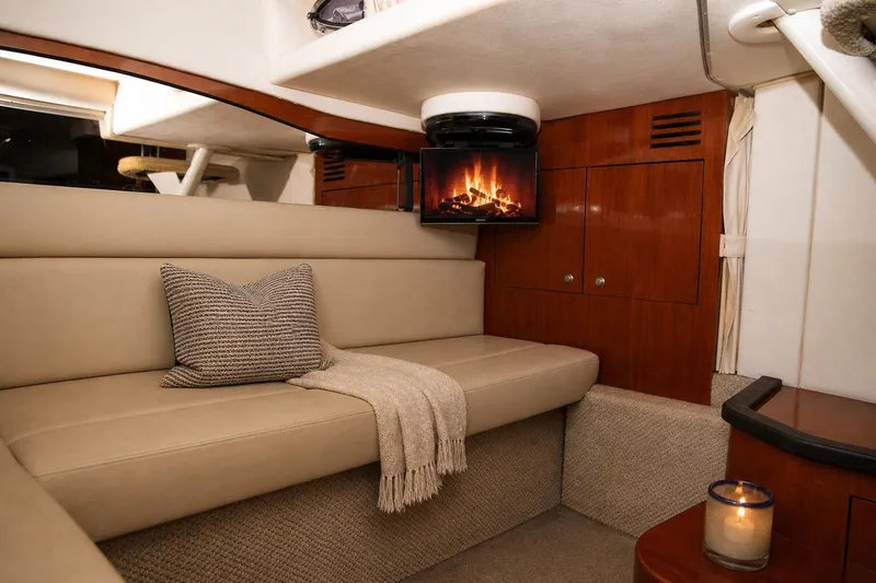 Slide: The Image of Luxurious interior of 2006 Sea Ray 340 Sundancer with cozy seating and ambient lighting. - 8