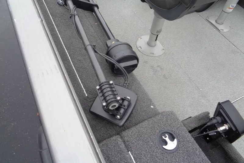 Slide: The Image of 2011 Lund 2010 Pro Guide boat interior with mounted equipment and seating. - 13