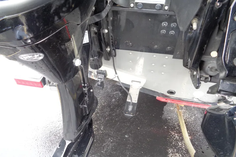 Slide: The Image of Close-up of a 2011 Lund 2010 Pro Guide boat motor and transom. - 19