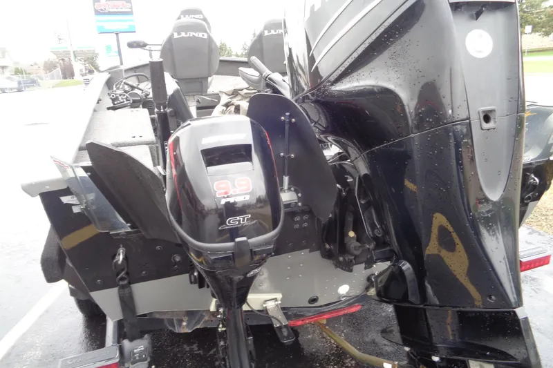 Slide: The Image of 2011 Lund 2010 Pro Guide boat with Mercury 9.9 ProKicker outboard motor. - 4