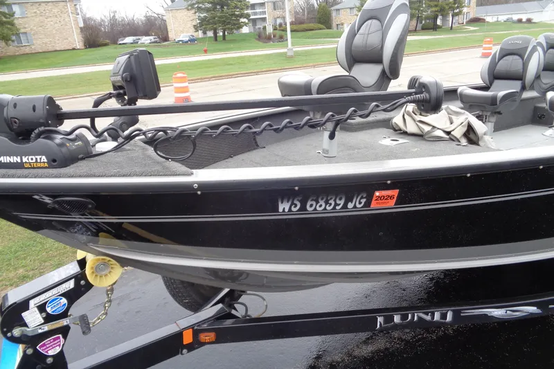 Slide: The Image of 2010 Lund Pro Guide boat on trailer, featuring Minn Kota Ulterra motor. - 7