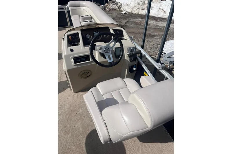 Slide: The Image of 2014 Bennington 22 SLX boat interior with steering wheel and seating. - 3