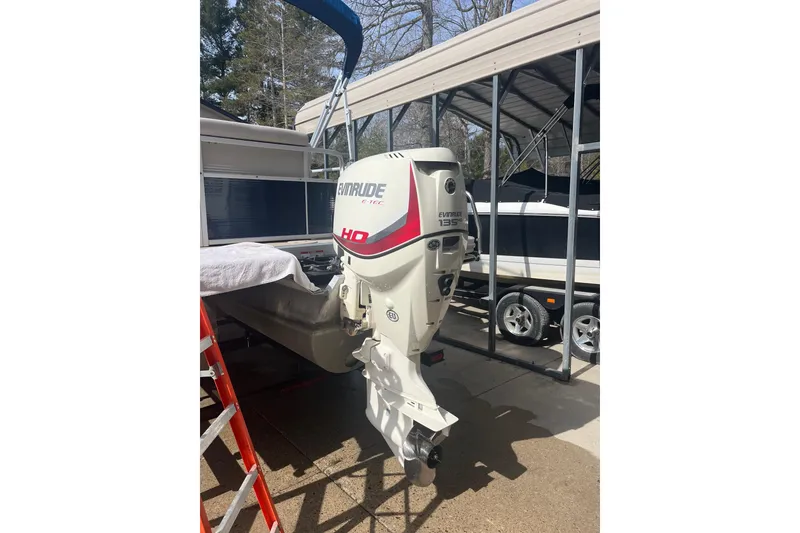 Slide: The Image of 2014 Bennington 22 SLX with Evinrude 135 HP outboard motor in storage. - 6
