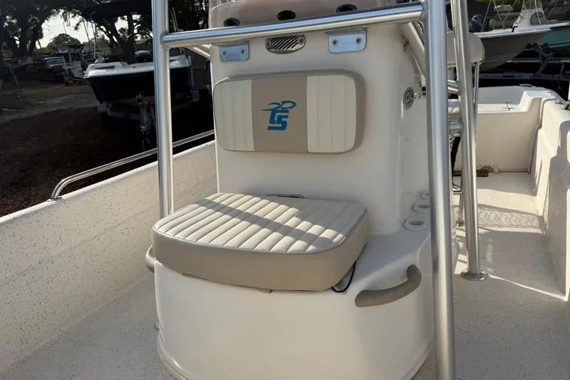 Slide: The Image of 2019 Carolina Skiff 18 JVX CC boat interior with cushioned seating and console. - 10