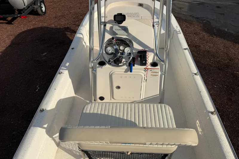 Slide: The Image of 2019 Carolina Skiff 18 JVX CC boat interior with steering console and seating. - 11