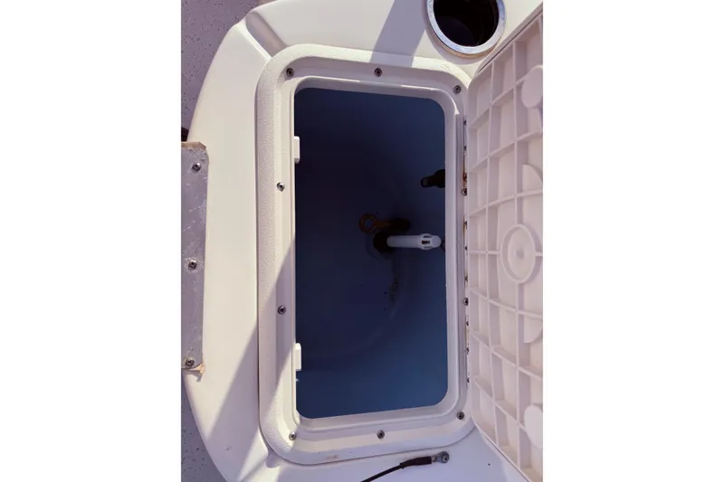 Slide: The Image of Open storage compartment on 2019 Carolina Skiff 18 JVX CC boat. - 13