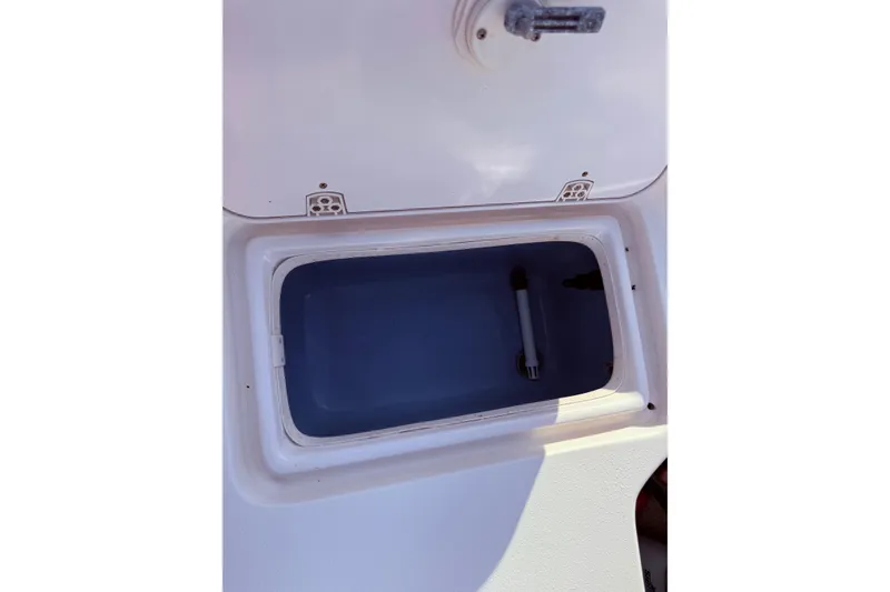 Slide: The Image of 2019 Carolina Skiff 18 JVX CC livewell compartment, open and empty. - 15