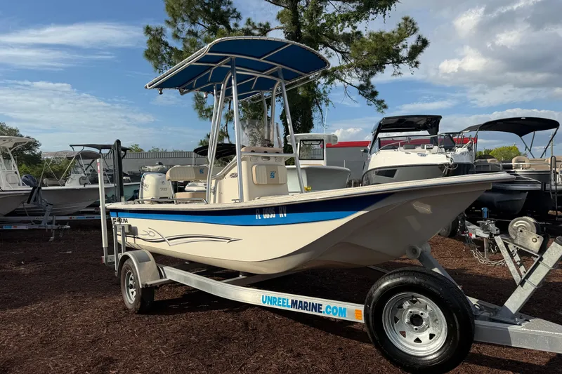 Slide: The Image of 2019 Carolina Skiff 18 JVX CC boat on trailer, outdoor display. - 2