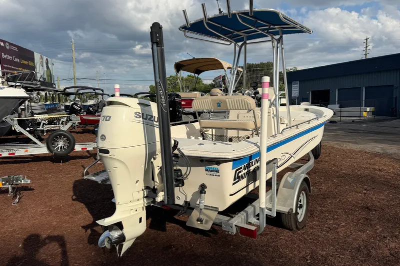Slide: The Image of 2019 Carolina Skiff 18 JVX CC boat with Suzuki engine on trailer, outdoor display. - 6