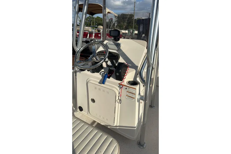 Slide: The Image of 2019 Carolina Skiff 18 JVX CC boat console with steering wheel and navigation equipment. - 8