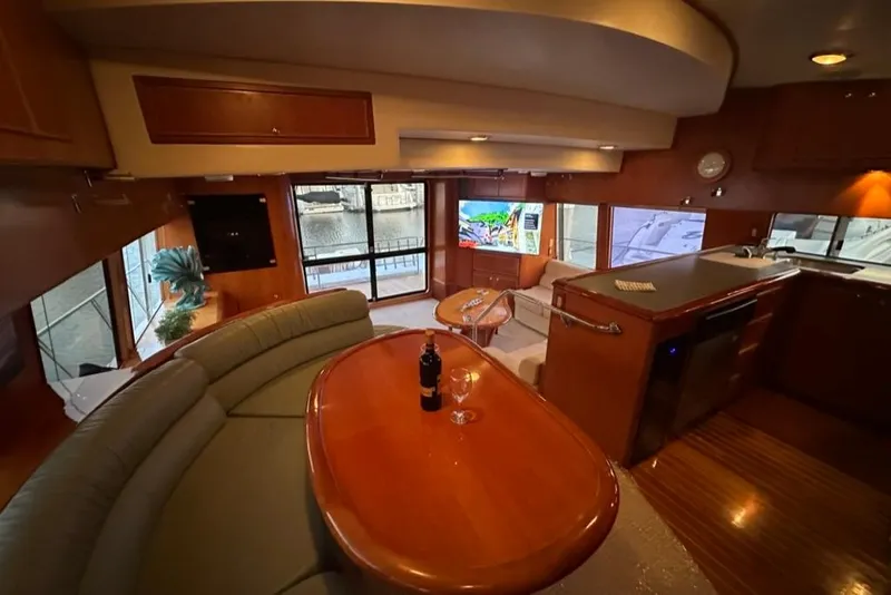 Slide: The Image of Luxurious interior of a 1999 Mikelson 64 Long Range Sportfish yacht with elegant furnishings. - 14