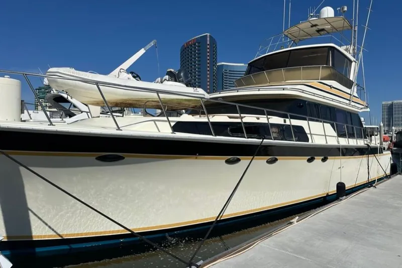Slide: The Image of 1999 Mikelson 64 Long Range Luxury Sportfish yacht docked in marina, sunny day. - 2