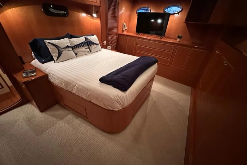 Slide: The Image of Luxurious bedroom interior of 1999 Mikelson 64 Long Range Sportfish yacht. - 22