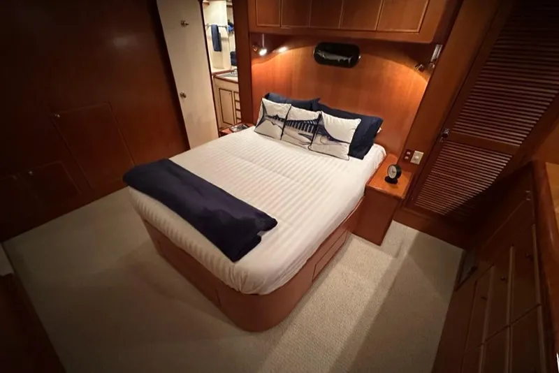 Slide: The Image of Luxurious bedroom interior of 1999 Mikelson 64 Long Range Luxury Sportfish yacht. - 23