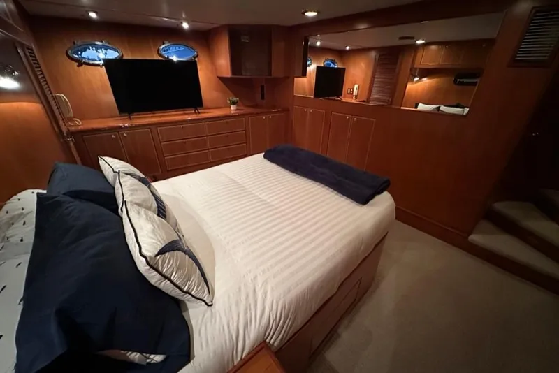 Slide: The Image of Luxurious bedroom interior of 1999 Mikelson 64 Long Range Luxury Sportfish yacht. - 24