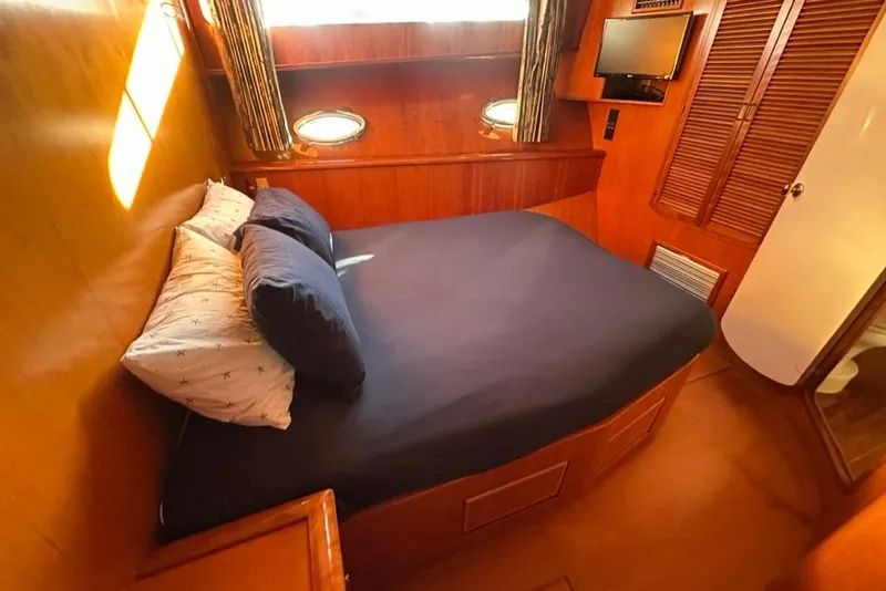 Slide: The Image of Luxurious cabin interior of 1999 Mikelson 64 Long Range Sportfish yacht. - 31