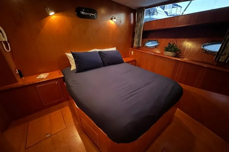 Slide: The Image of Luxurious cabin interior of 1999 Mikelson 64 Long Range Sportfish yacht. - 33