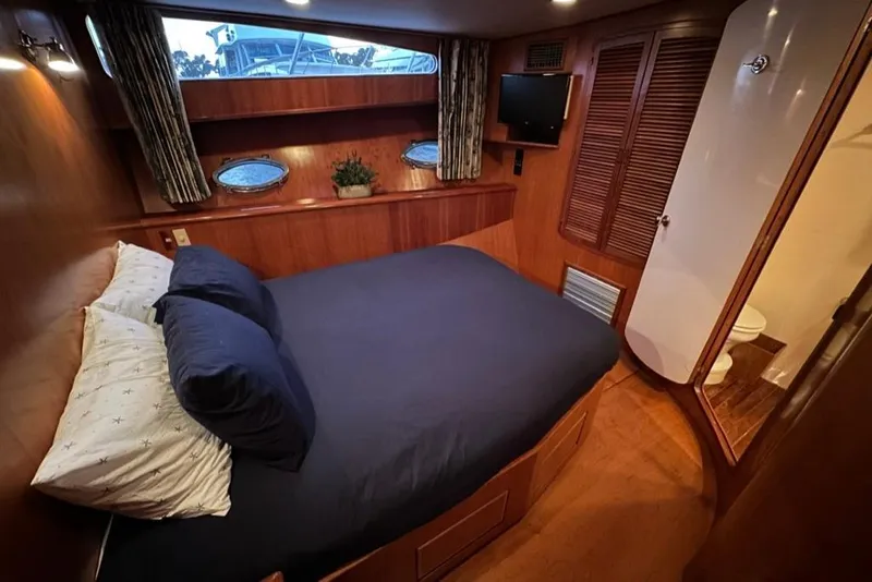 Slide: The Image of Luxurious cabin interior of a 1999 Mikelson 64 Long Range Sportfish yacht. - 34
