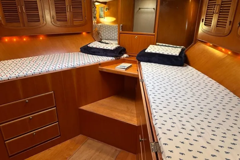 Slide: The Image of Luxurious wooden cabin interior of 1999 Mikelson 64 Long Range Luxury Sportfish yacht. - 37