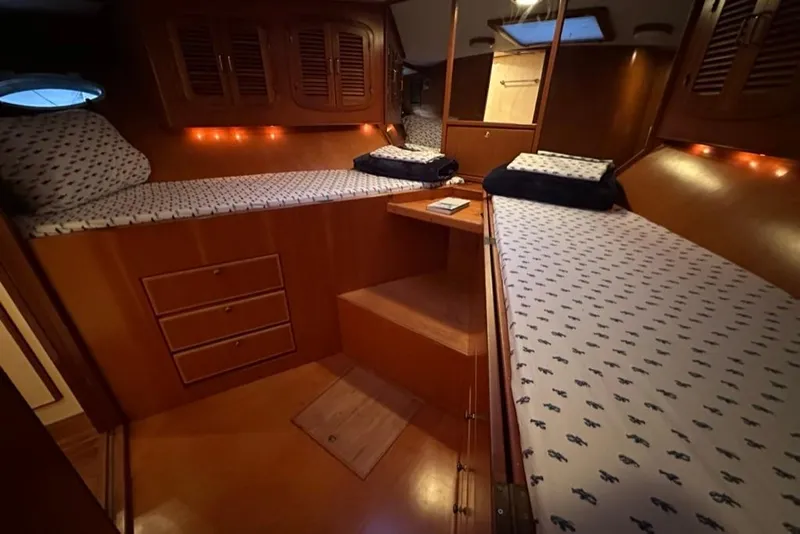 Slide: The Image of Luxurious cabin interior of a 1999 Mikelson 64 Long Range Sportfish yacht. - 39