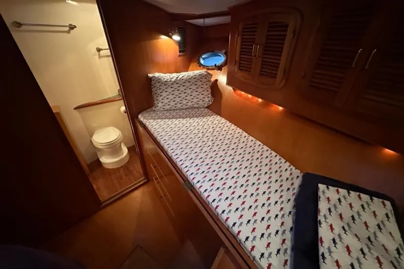 Slide: The Image of Cozy cabin interior of 1999 Mikelson 64 Long Range Luxury Sportfish yacht. - 42