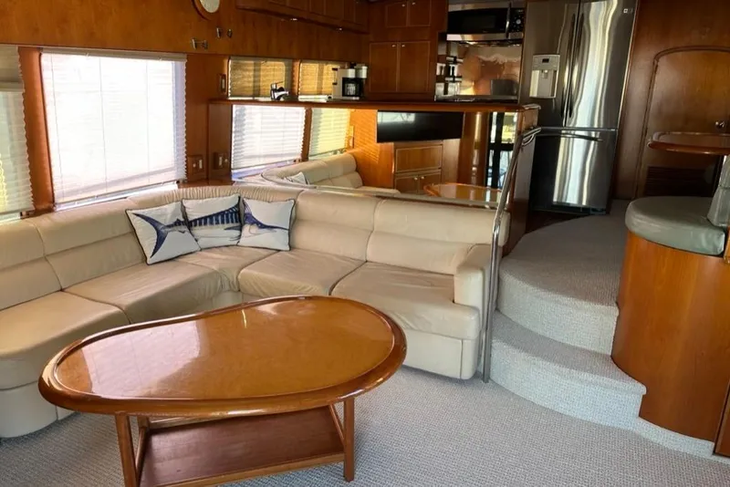 Slide: The Image of Luxurious interior of a 1999 Mikelson 64 Long Range Sportfish yacht with elegant seating and modern kitchen. - 5