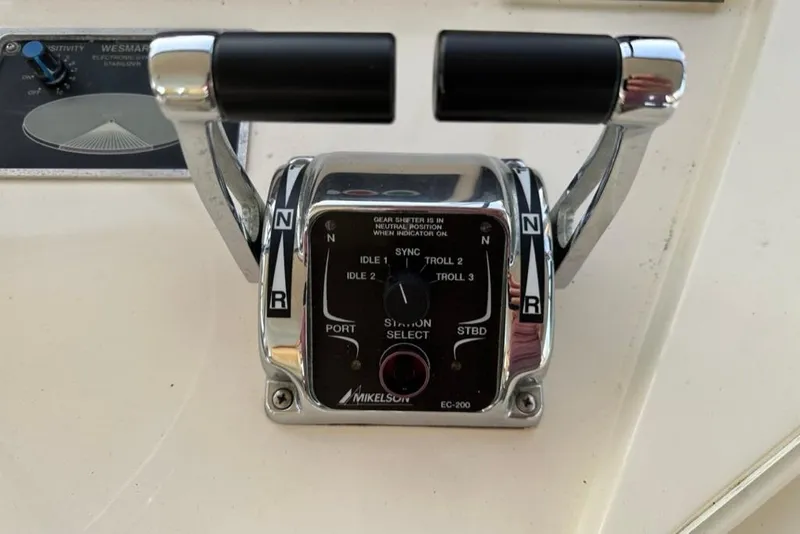 Slide: The Image of Throttle control panel of a 1999 Mikelson 64 Long Range Luxury Sportfish yacht. - 51