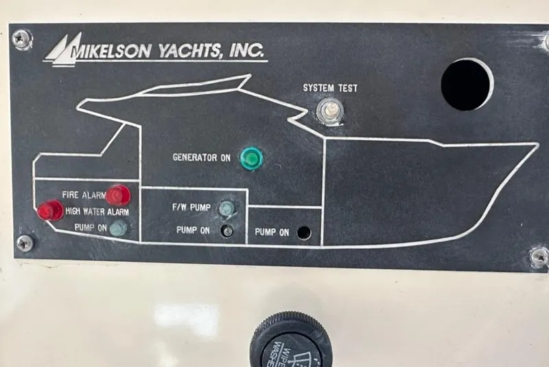 Slide: The Image of Control panel of a 1999 Mikelson 64 Long Range Luxury Sportfish yacht with system indicators. - 54