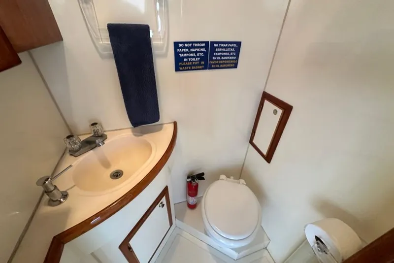 Slide: The Image of Bathroom interior of 1999 Mikelson 64 Long Range Luxury Sportfish yacht. - 55