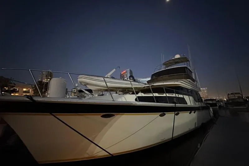 Slide: The Image of 1999 Mikelson 64 Long Range Luxury Sportfish yacht docked at night. - 57