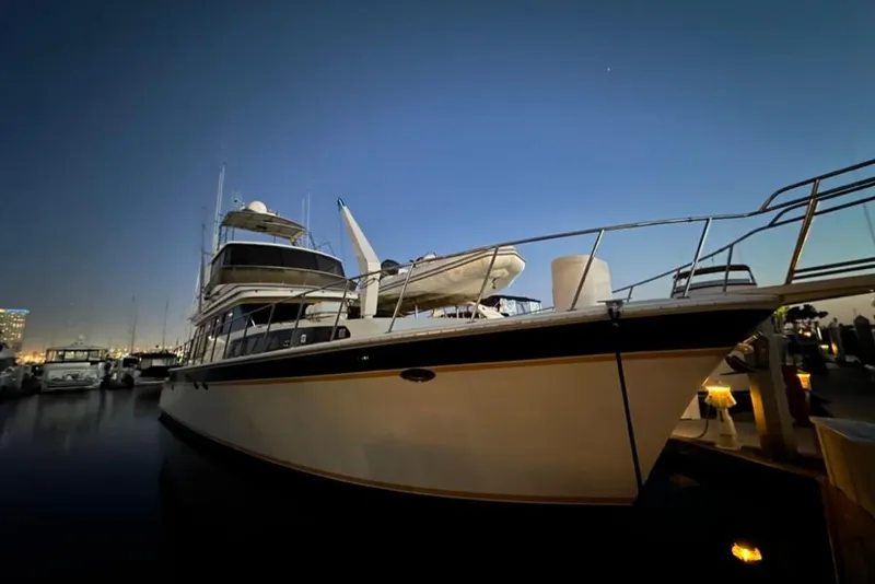 Slide: The Image of 1999 Mikelson 64 Long Range Luxury Sportfish yacht docked at sunset. - 58