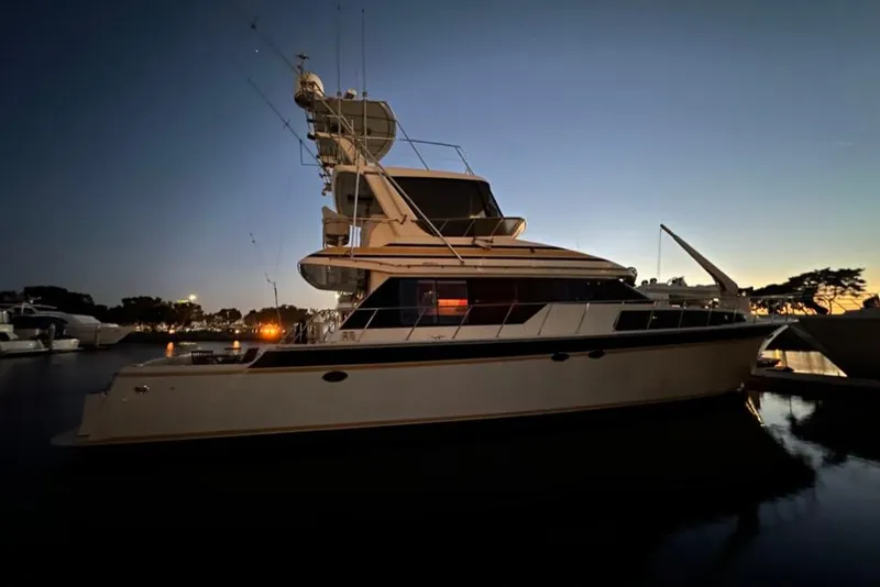 Slide: The Image of 1999 Mikelson 64 Long Range Luxury Sportfish yacht docked at sunset. - 60