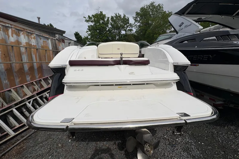 Slide: The Image of 2013 Cobalt 242 boat rear view with swim platform and ladder. - 16