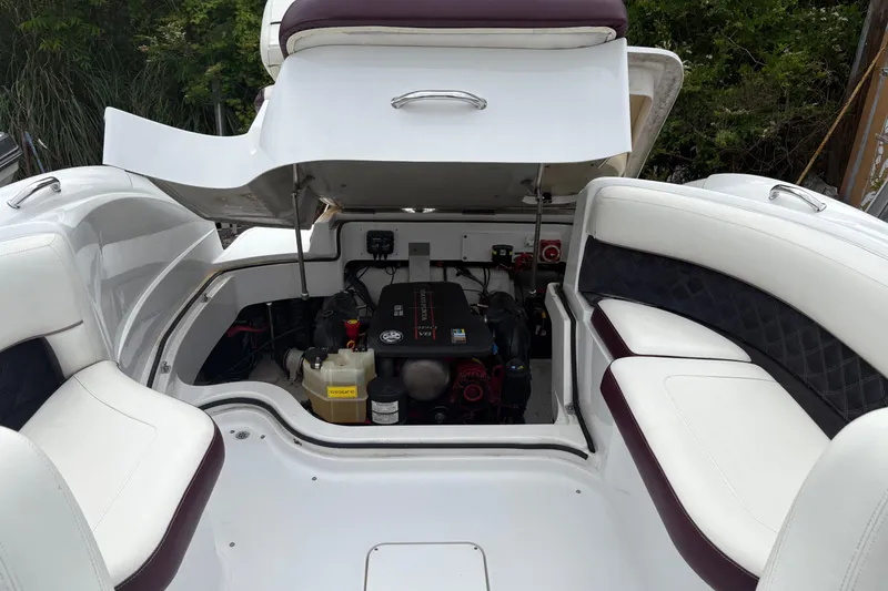 Slide: The Image of Open engine compartment of a 2013 Cobalt 242 boat, showcasing interior components. - 9