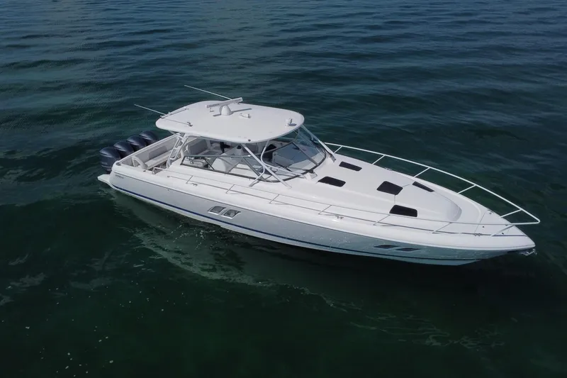 Slide: The Image of 2017 Intrepid 475 Sport Yacht cruising on calm waters, showcasing sleek design and powerful engines. - 2