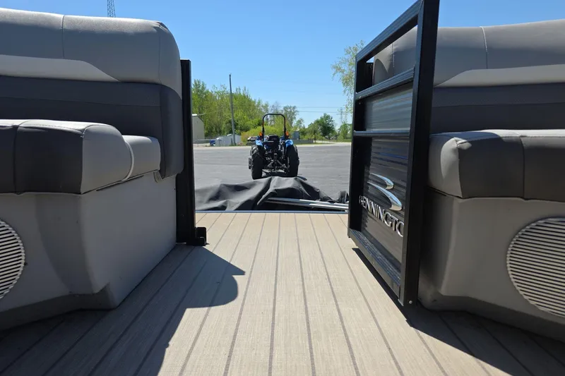 Slide: The Image of 2020 Bennington SX 22 SSLDX pontoon interior with tractor in background. - 10
