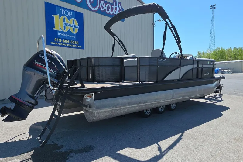 Slide: The Image of 2020 Bennington SX 22 SSLDX pontoon boat with Yamaha engine at dealership. - 2