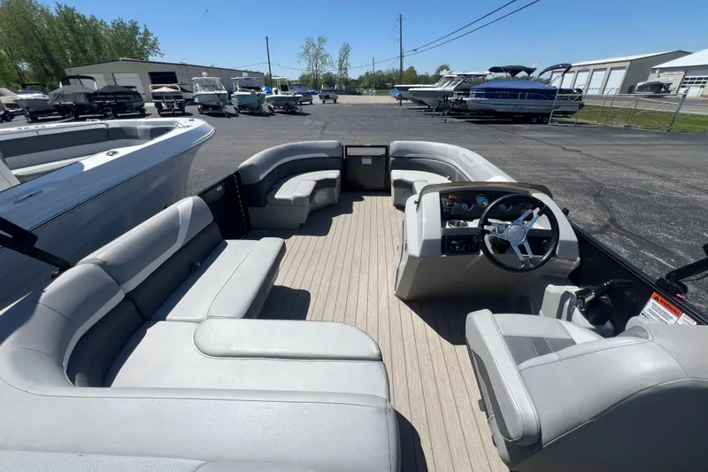 Slide: The Image of 2020 Bennington SX 22 SSLDX pontoon boat interior with spacious seating and modern helm. - 23