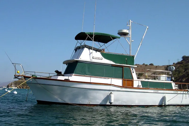 The Image of 1978 Californian 42 LRC yacht anchored in scenic coastal waters. - 0