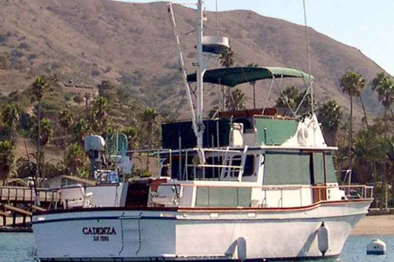 Slide: The Image of 1978 Californian 42 LRC yacht anchored near scenic palm-lined coastline. - 39