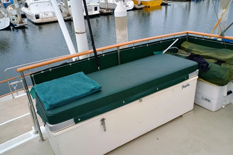 Slide: The Image of 1978 Californian LRC boat deck with green cushions and marina view. - 5