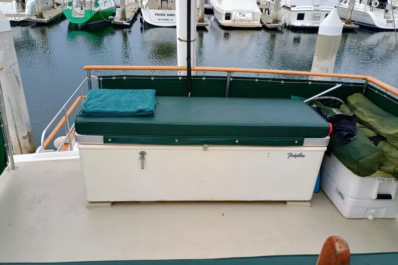 Slide: The Image of 1978 Californian LRC boat deck with storage bench and marina view. - 6
