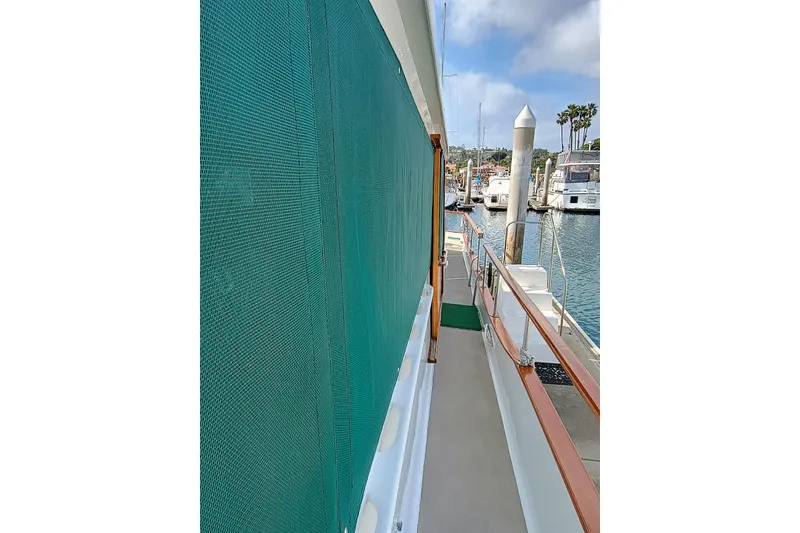 Slide: The Image of Side view of 1978 Californian LRC yacht docked at marina. - 9