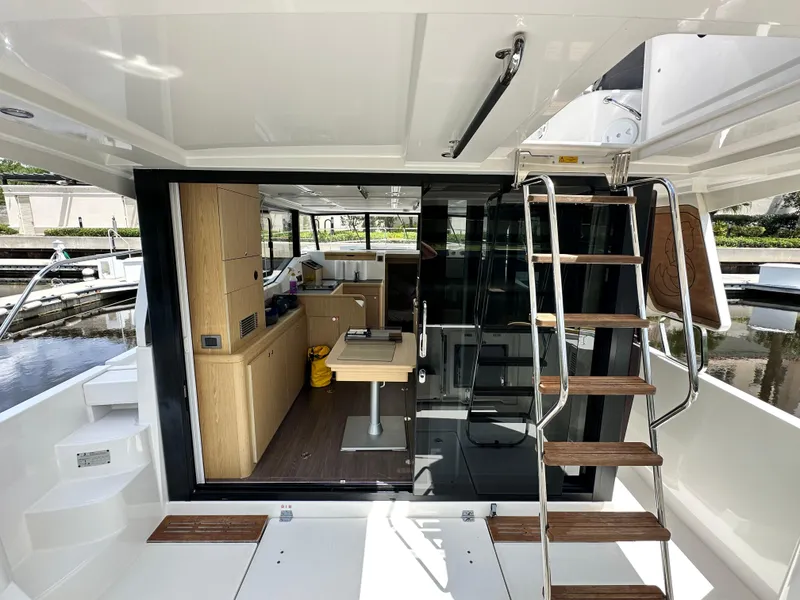 Slide: The Image of Interior view of 2022 Beneteau Swift Trawler 35, featuring modern design and wooden accents. - 10