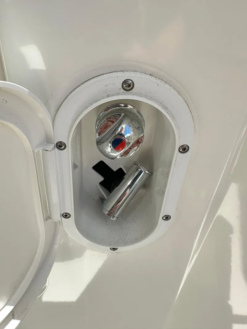 Slide: The Image of Water inlet on 2022 Beneteau Swift Trawler 35, featuring chrome cap and housing. - 19