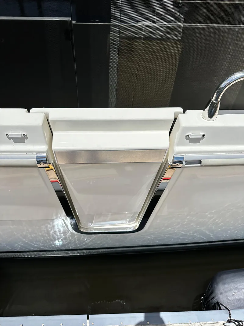 Slide: The Image of 2022 Beneteau Swift Trawler 35, rear deck view with stainless steel accents. - 38
